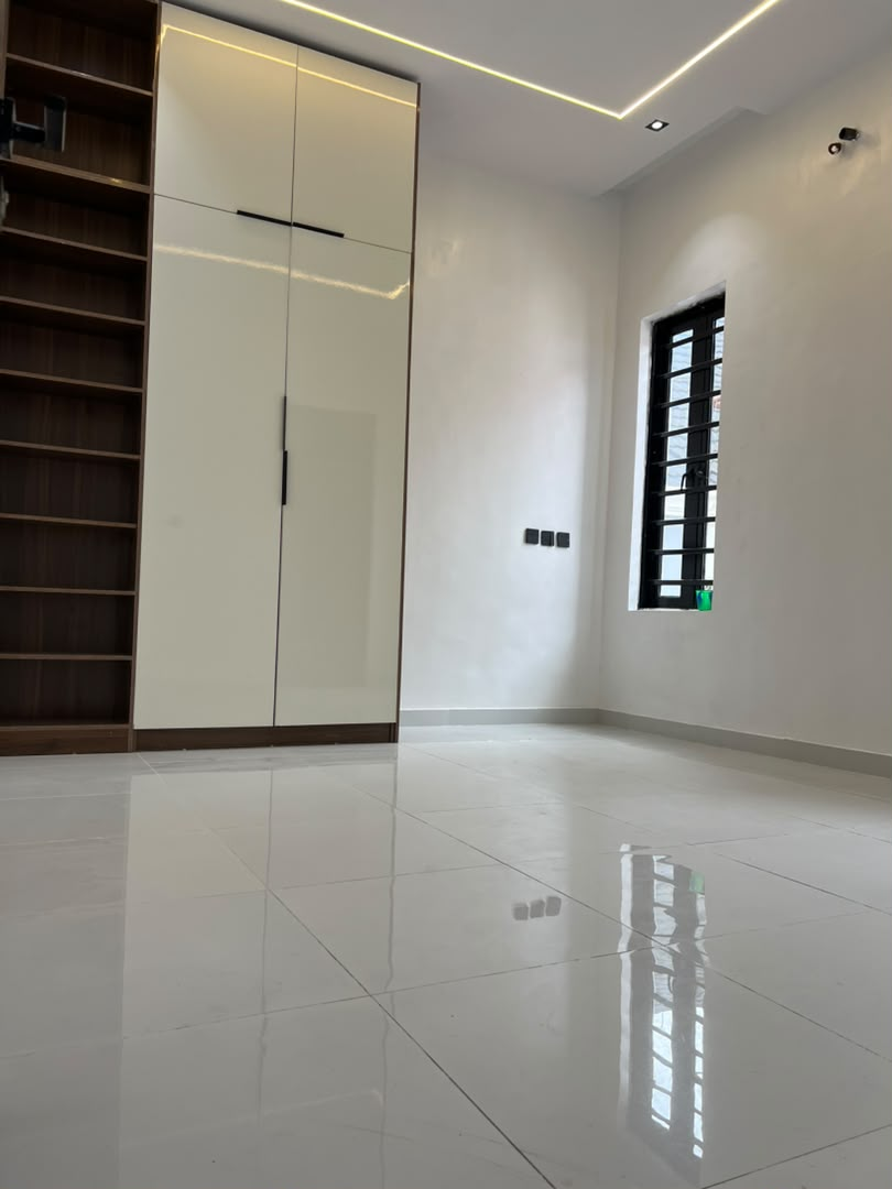 Bedroom with fitted wardrobe and shelving