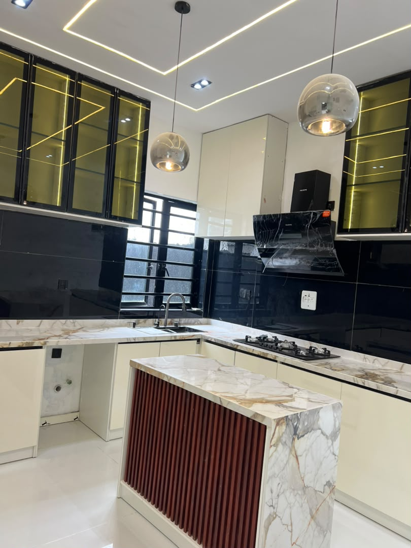 Fully fitted kitchen with island and marble worktops