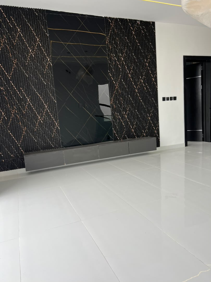 Family lounge with black marble feature wall